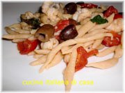 trofie con olive taggiasche, pescatrice e pomodorini  